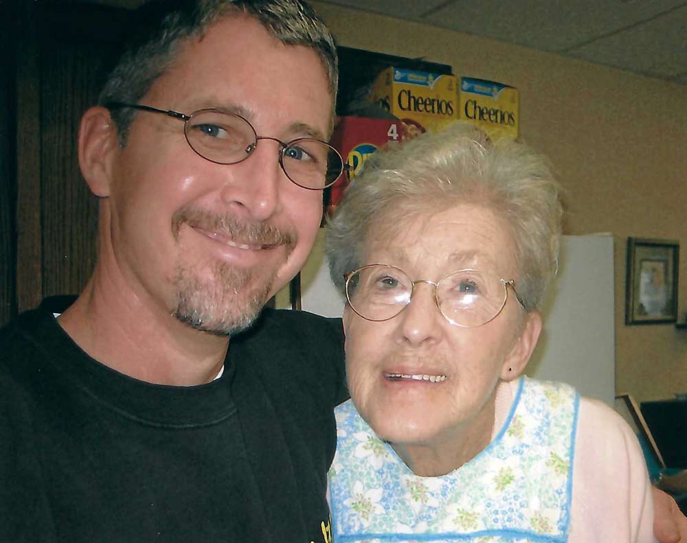 chuck barnes smiling with his mom