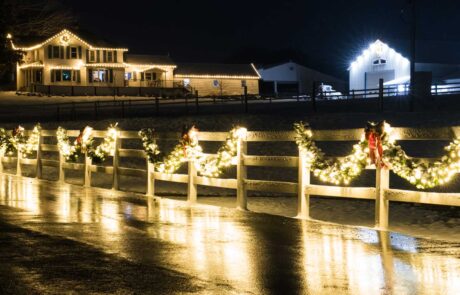 mooville buildings and fence decorated with lights and garland